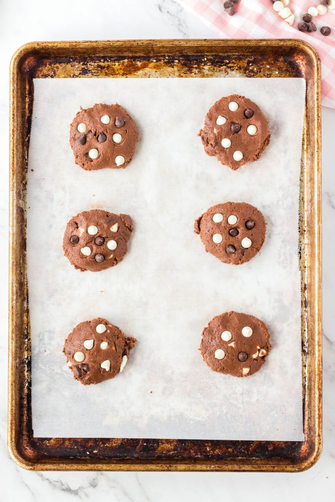 Spoon out cookie dough onto a parchment lined cookie sheet.