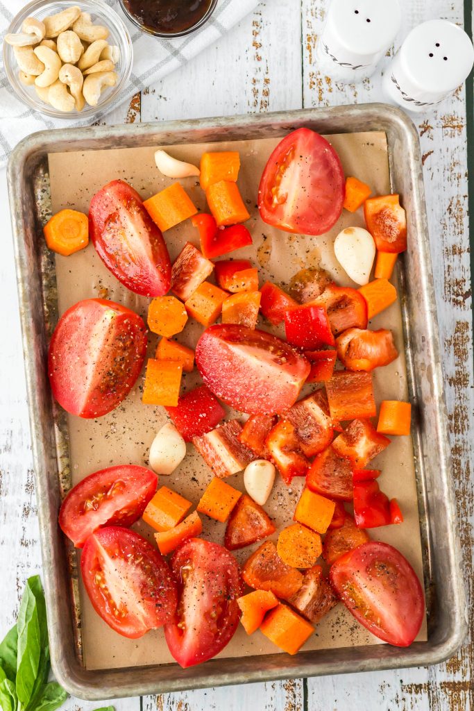 Cut up the veggies and add to a parchment lined baking sheet.