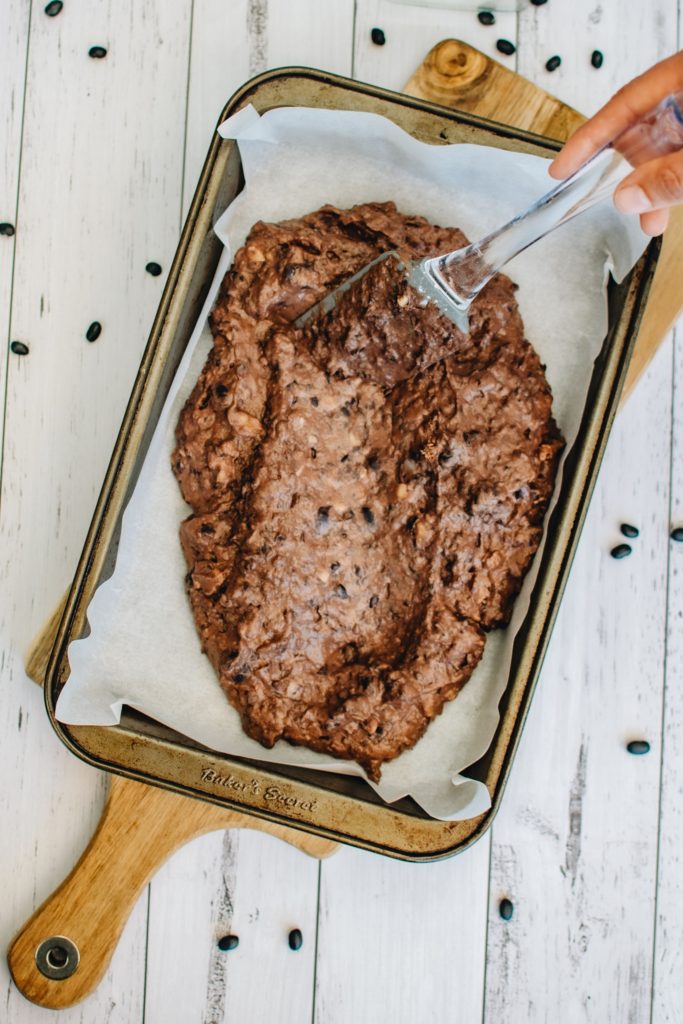 Add black bean brownie batter to a brownie pan.
