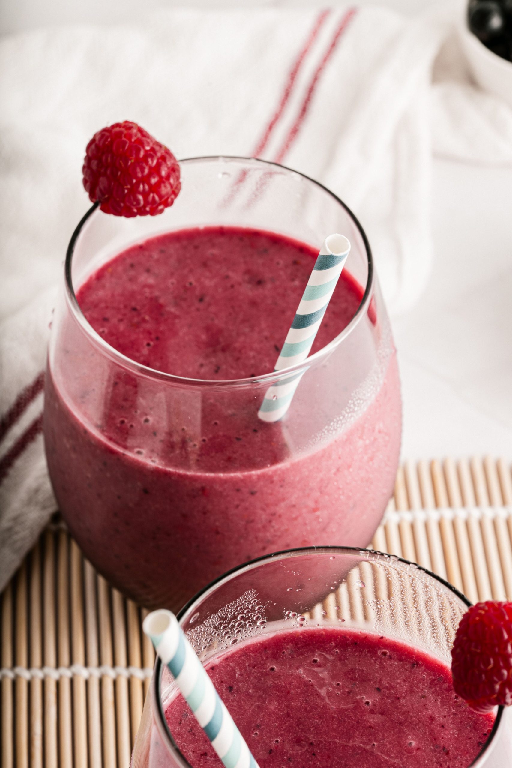 This quick and easy Mixed Berry Smoothie is the perfect breakfast or mid-day snack. Super refreshing to enjoy in the summer. This smoothie is vegan, raw, and ready to enjoy in under 10 minutes!