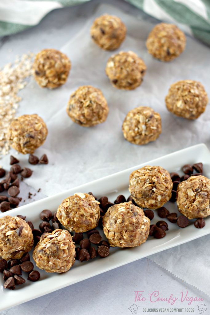 Peanut butter power bites on a plate with some chocolate chips.