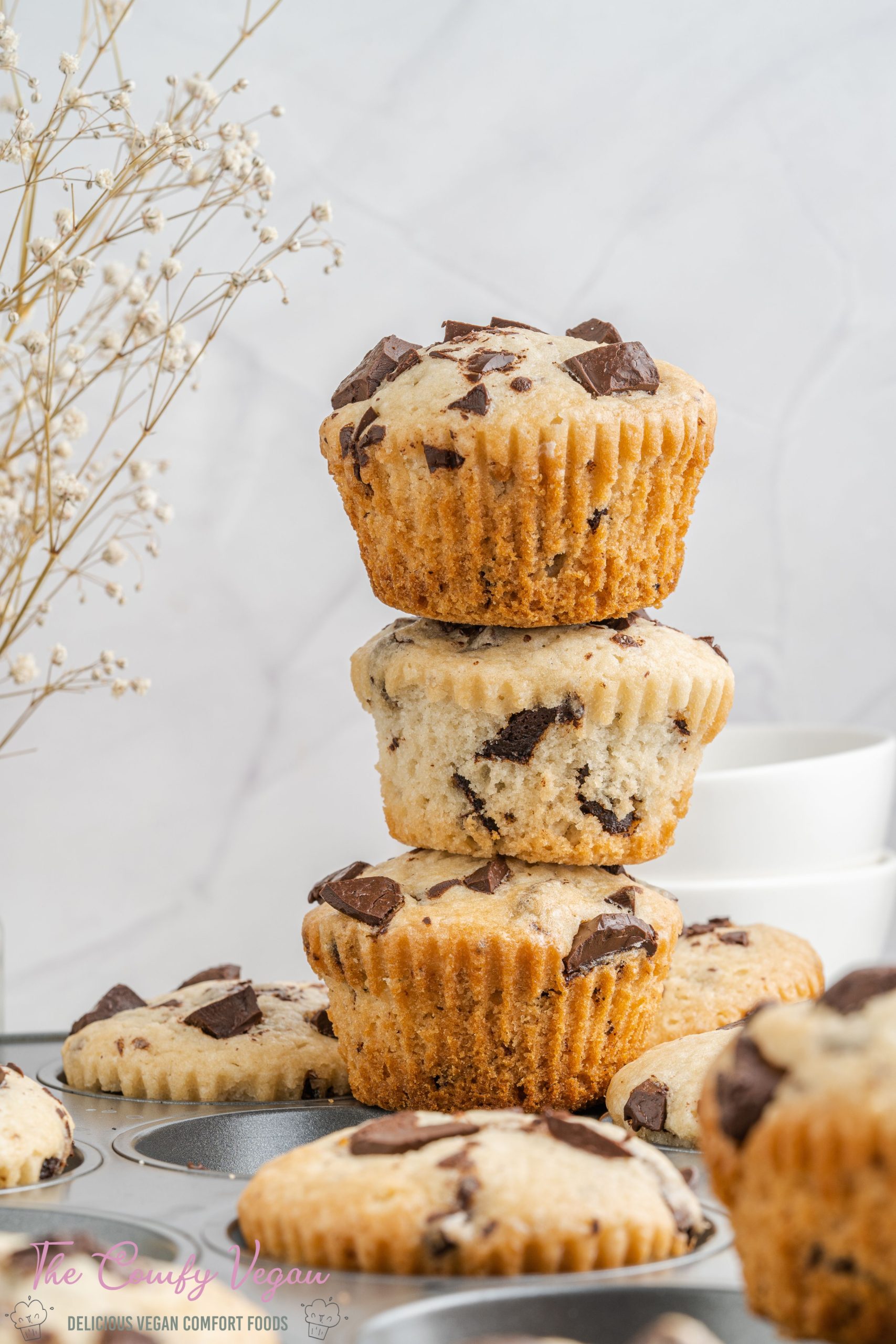 These Vegan Chocolate Chip Muffins are moist and soft on the inside. Made with common vegan pantry staples they're so easy to make. They're sweet, with a bold vanilla and chocolate flavor. Great as a snack or with coffee.