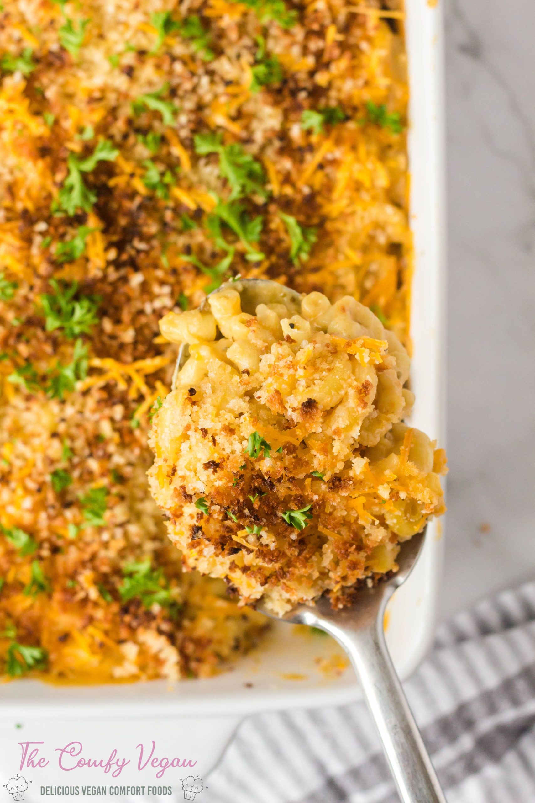 Vegan Baked Mac and Cheese is a classic comfort casserole turned vegan! It's cheesy, creamy, full of flavor, and ready to enjoy in just 30 minutes. This vegan mac and cheese is easy to make and a perfect weeknight dinner.