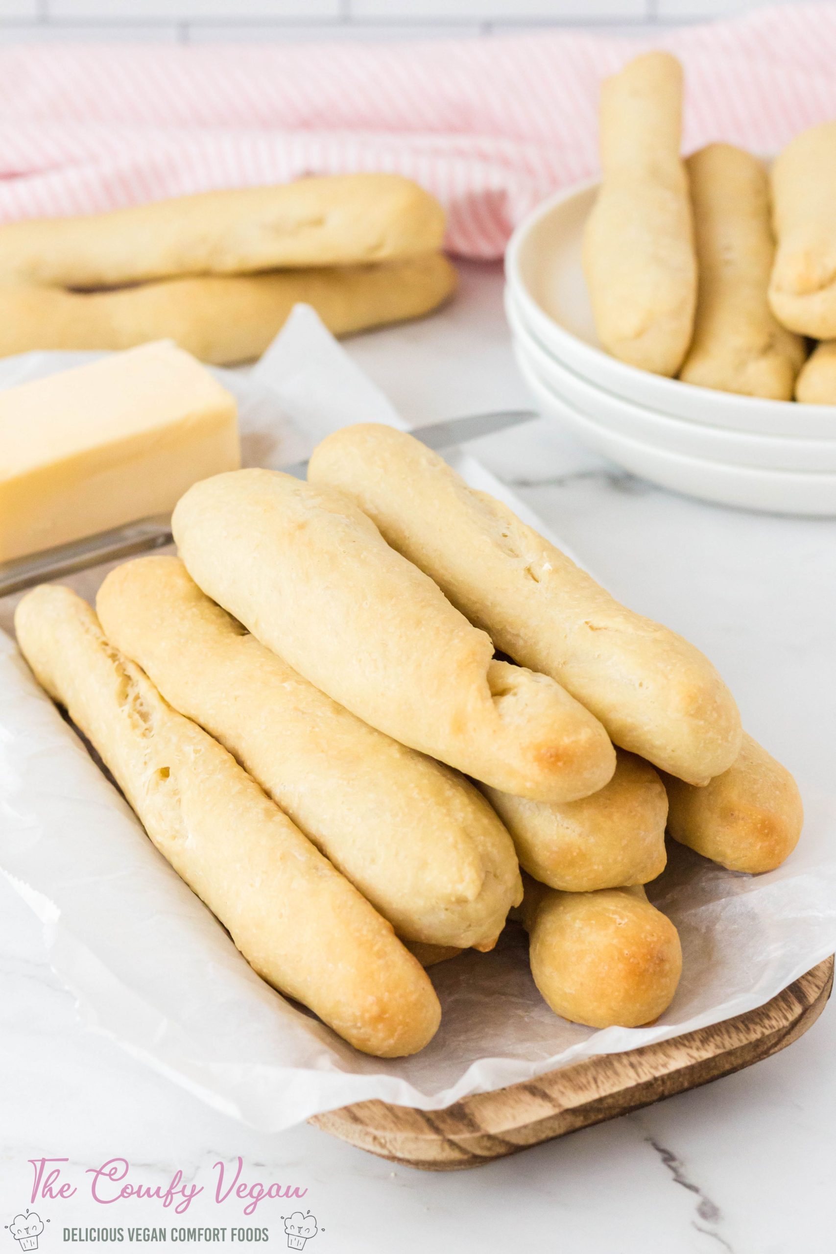 These easy to make homemade Vegan Bread Sticks go perfectly with soups, salads, pastas, and stews. They're soft, buttery, and oh so comforting. All you need are six common vegan pantry staples to make these Homemade Vegan Breadsticks.