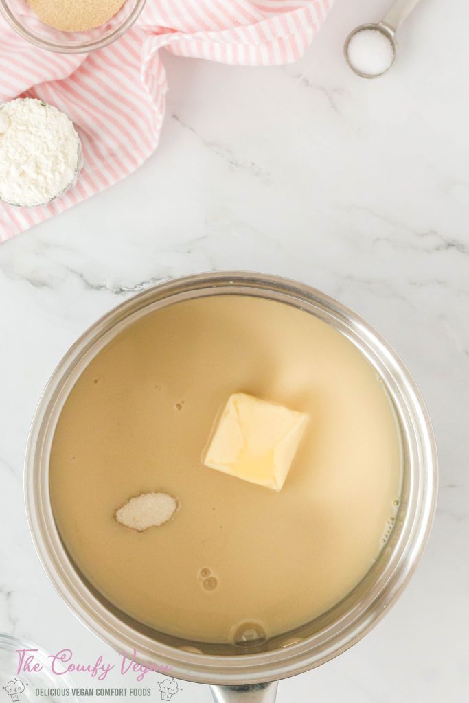 Vegan butter, sugar, and oat milk in a saucepan.