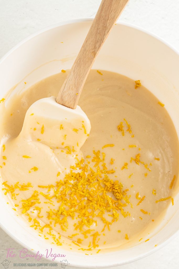 Add the orange zest to the cake batter.