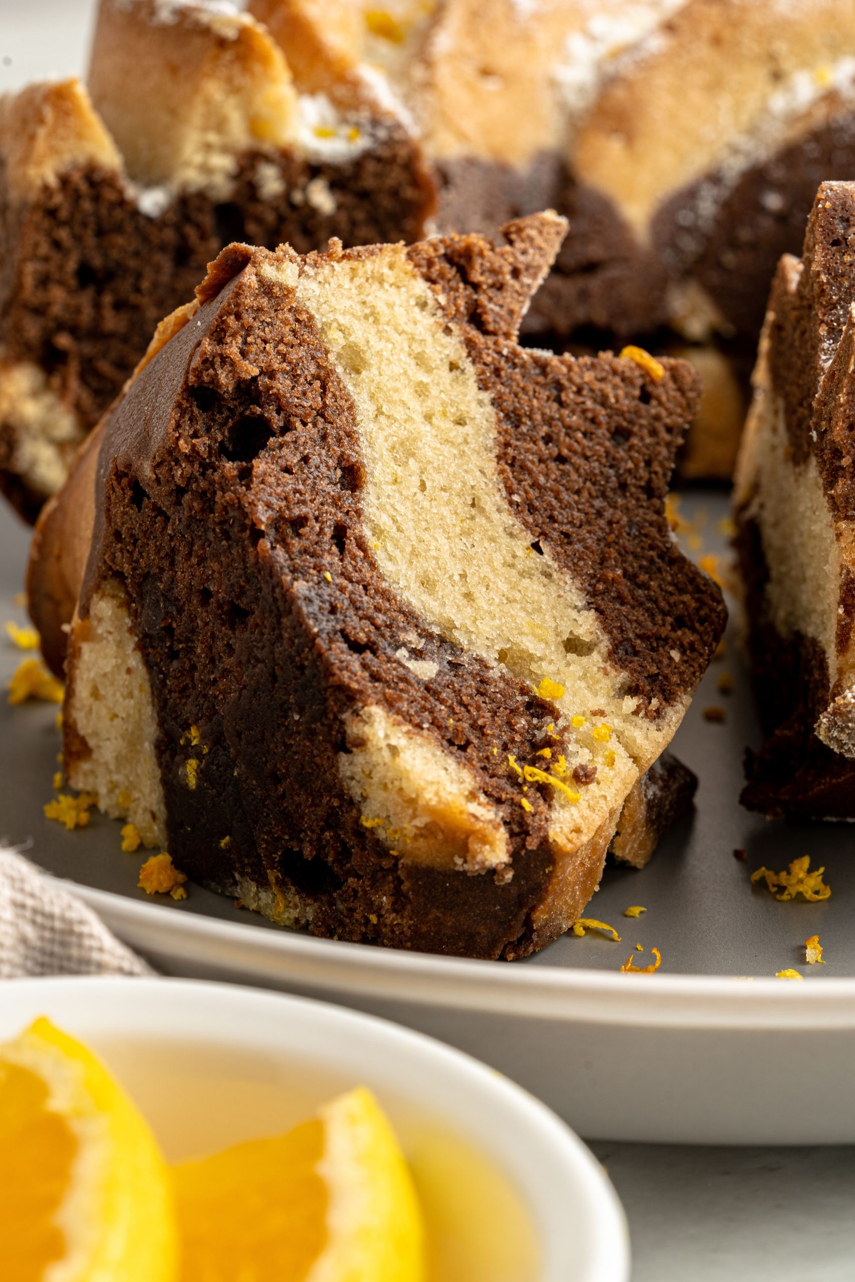 This Vegan Orange and Chocolate Marble Cake is moist and full of flavor. This vegan marble cake is the perfect dessert. Dust with some powdered sugar and enjoy with a cup of coffee.