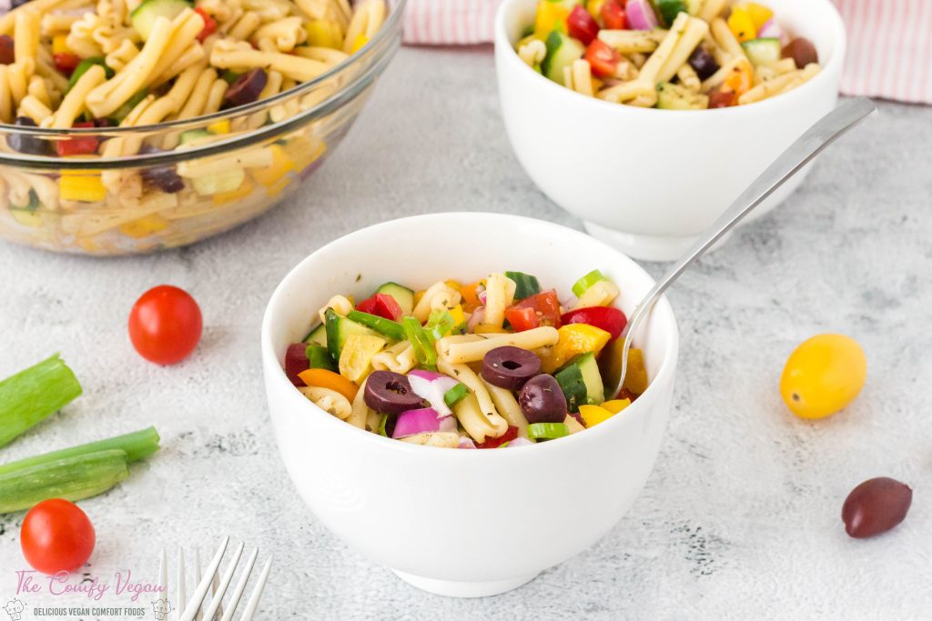 a side view of the bowl of vegan pasta salad.