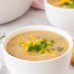 A bowl of vegan potato leek soup.