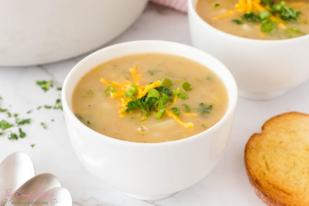 A bowl of creamy vegan potato leek soup.