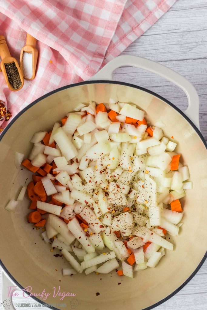 Add veggies to a stock pot.