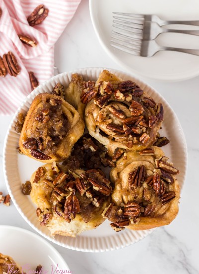 A plate of vegan sticky buns with an overhead view