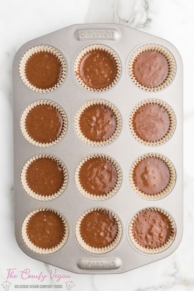 Add the cake batter to the prepared cupcake pan.