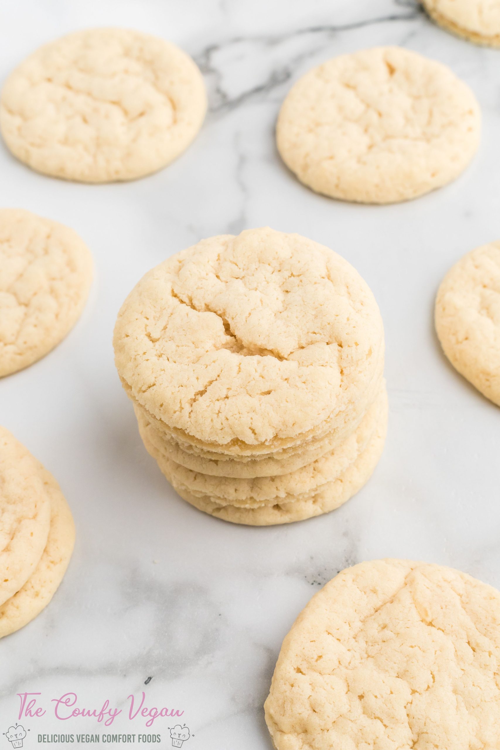 Enjoy these delicious Vegan Sugar Cookies. They're an easy one-bowl recipe that is ready to enjoy in under 30 minutes. Loved by all, these cookies are soft on the inside and slightly crispy on the edges. Top with some quick icing to take these cookies to the next level.